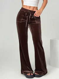 Brown velvet pants with a drawstring waist on a white background