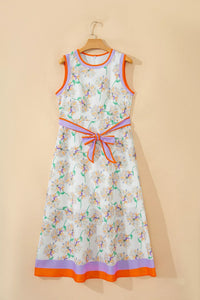 Floral dress with colorful trim on a beige background