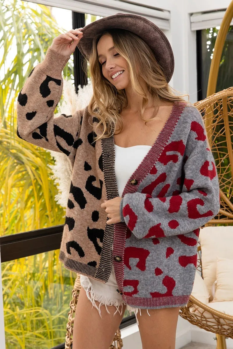 Woman wearing a patterned cardigan with a blurred outdoor background