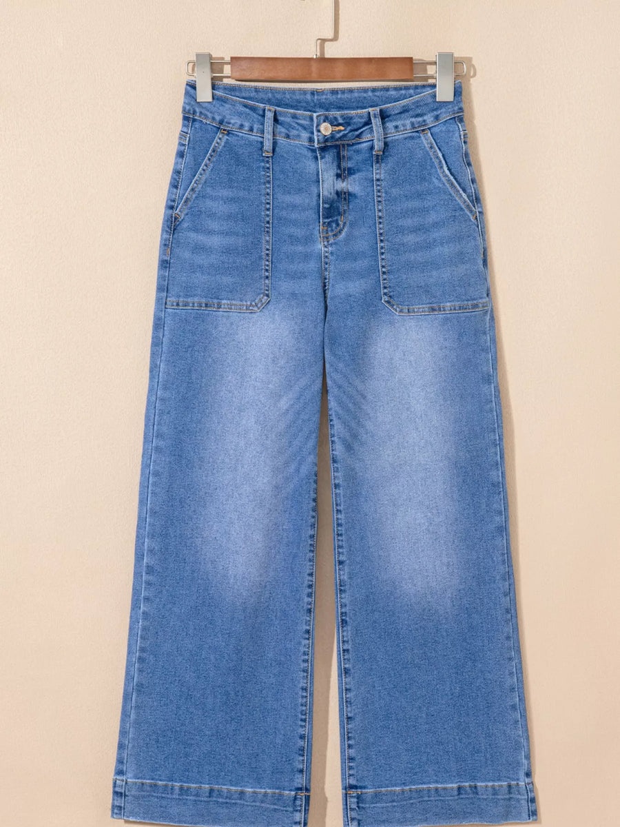 Blue jeans on a beige background