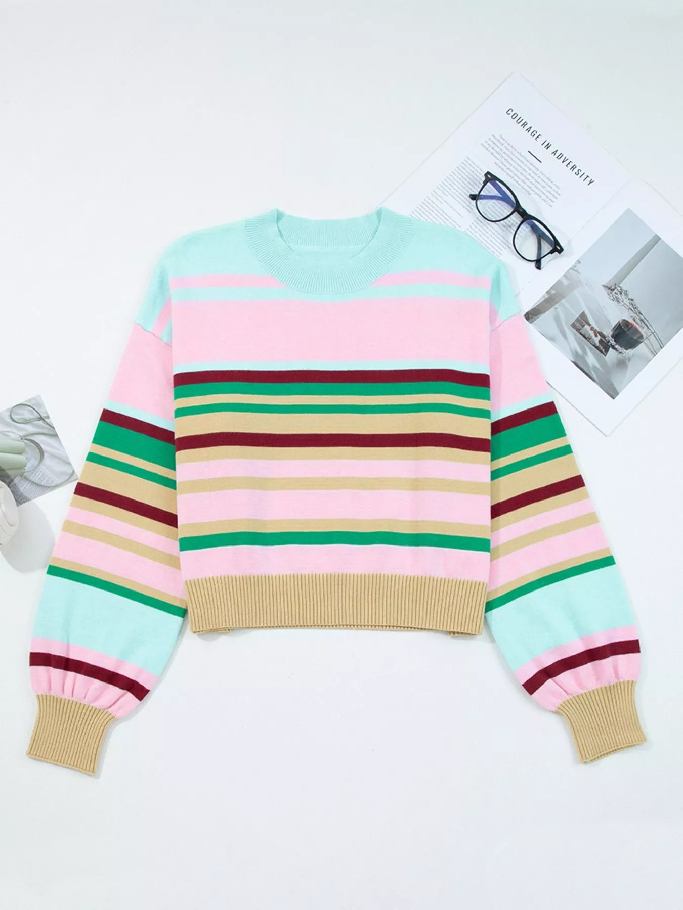 Colorful striped sweater on a white background