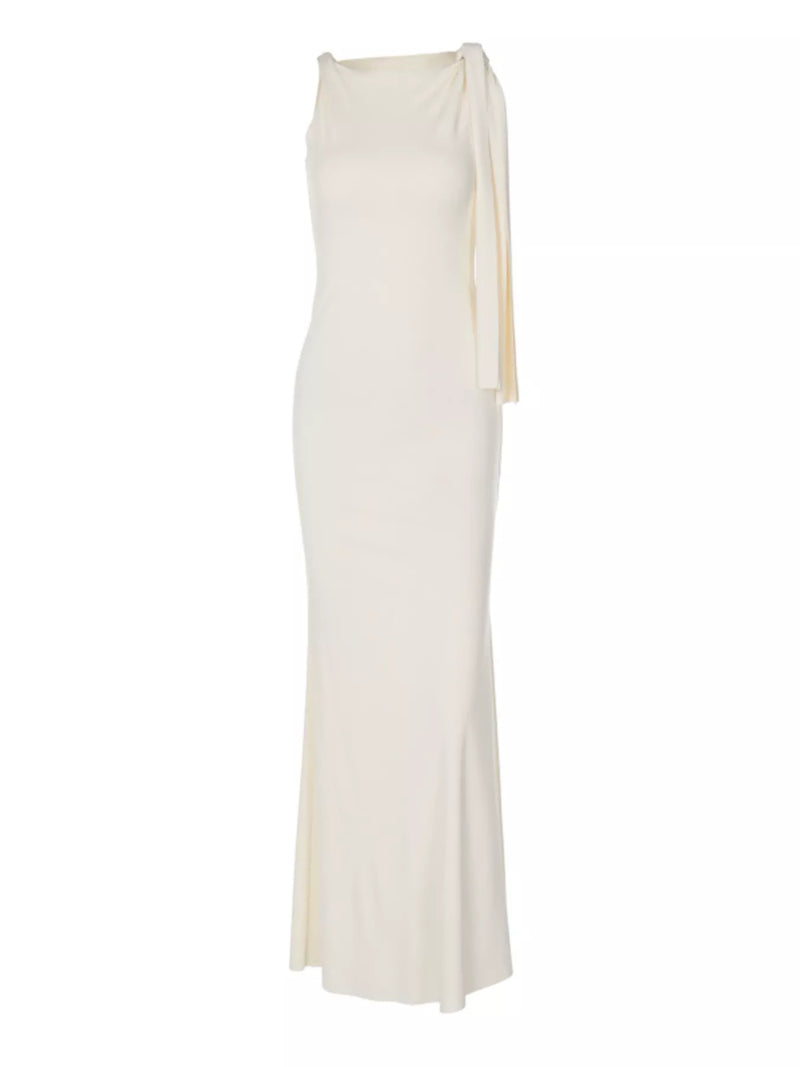 White evening gown with a draped design on a white background