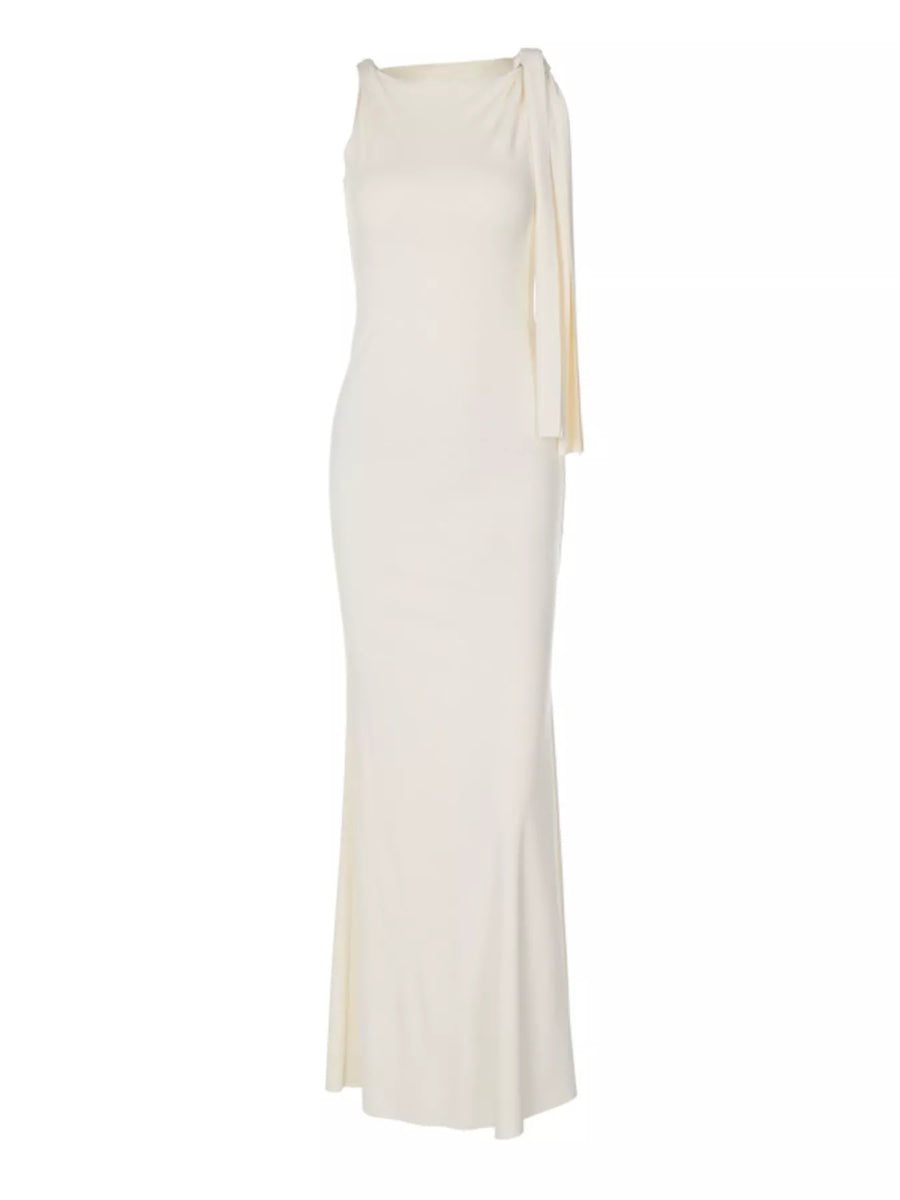 White evening gown with a draped design on a white background