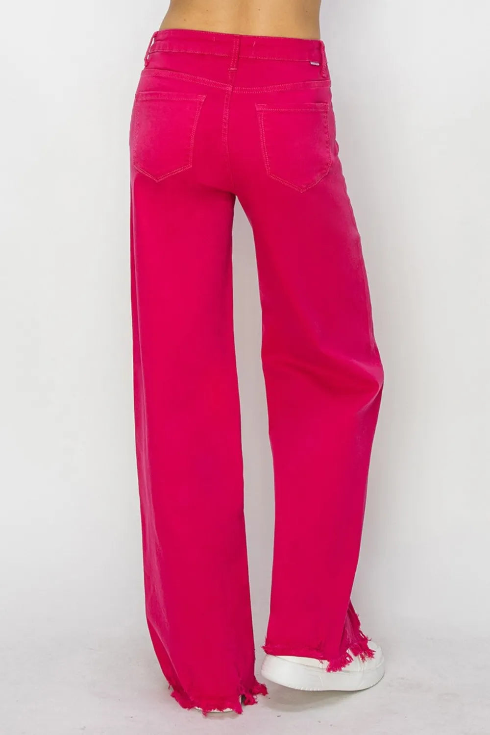 Bright pink pants on a white background