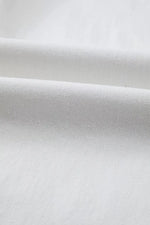 Close-up of white fabric with a subtle texture