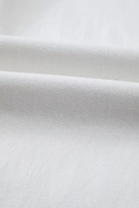 Close-up of white fabric with a subtle texture