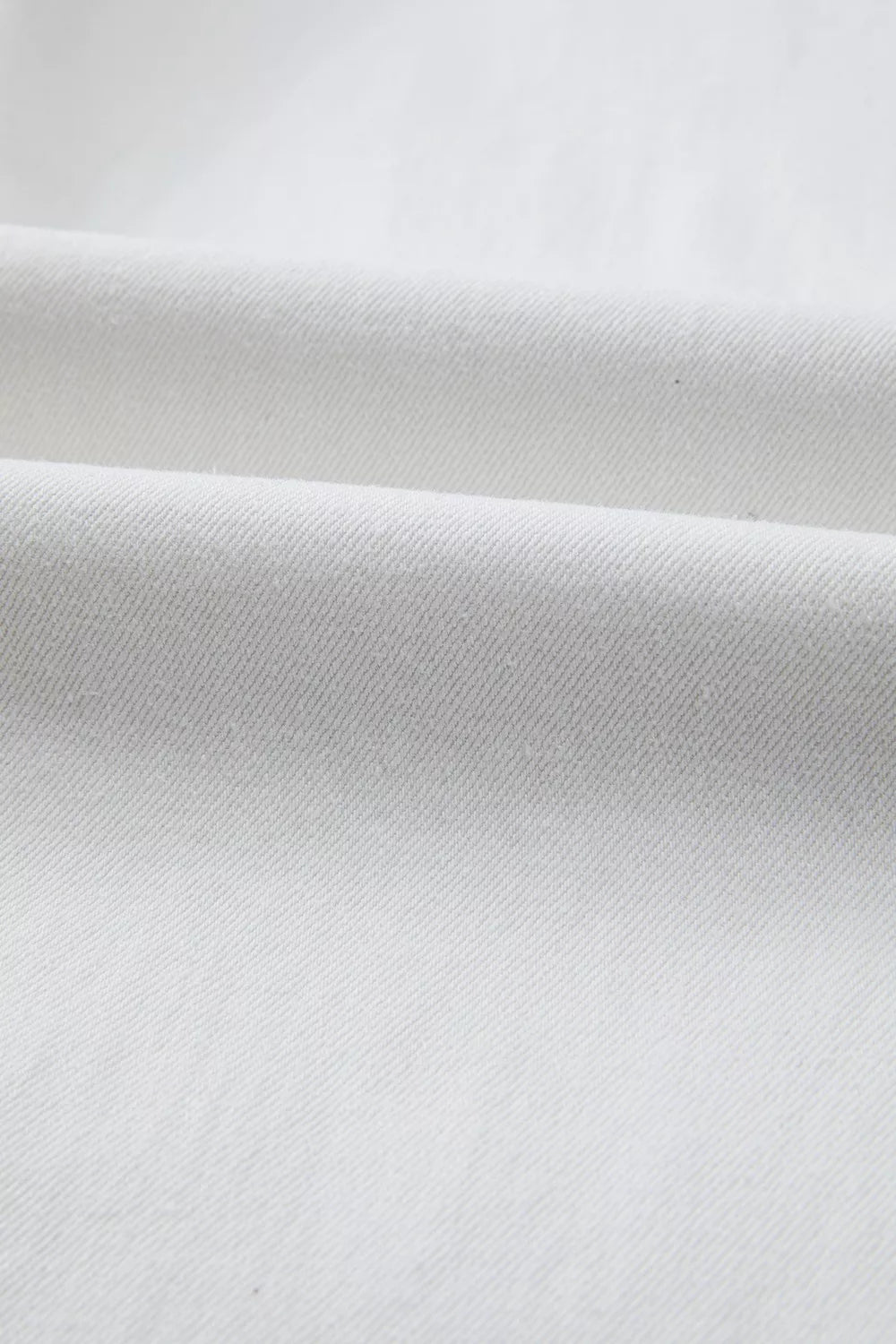 Close-up of white fabric with a subtle texture
