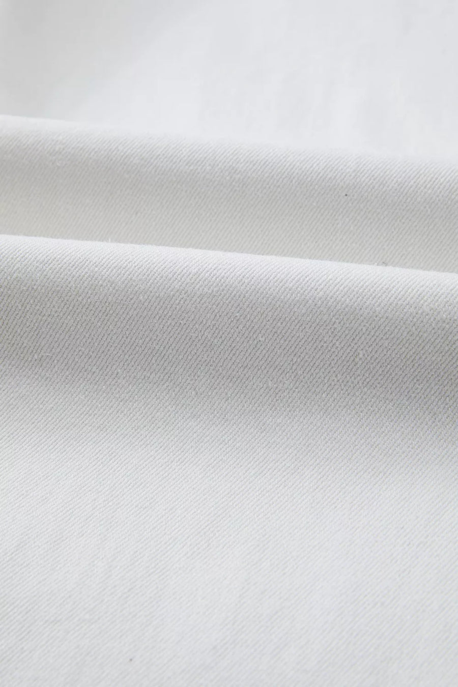 Close-up of white fabric with a subtle texture