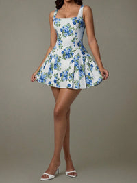 Woman wearing a floral dress with a plain background