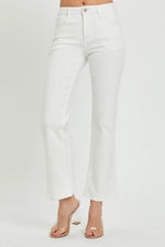 White jeans worn by a person on a white background