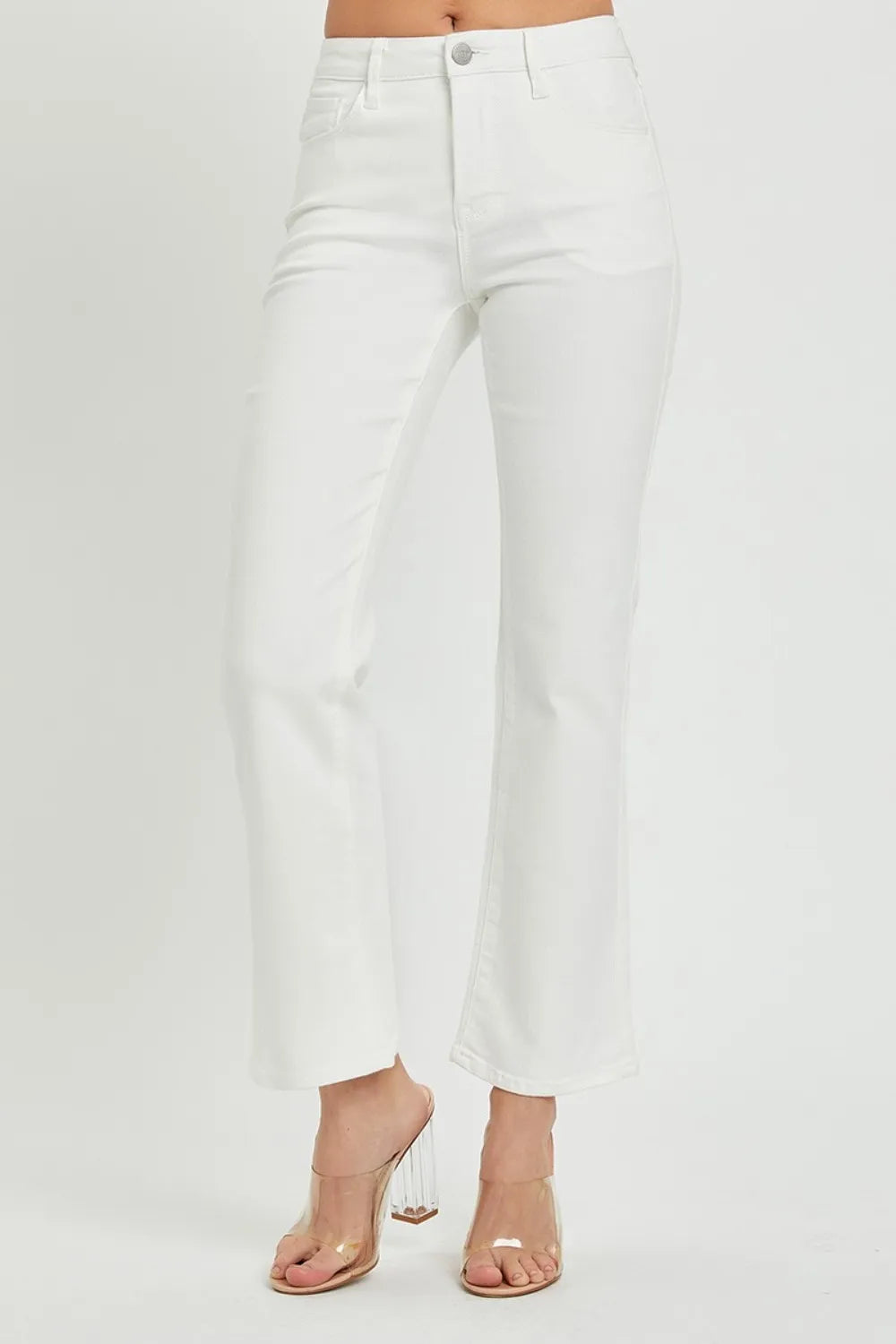 White jeans worn by a person on a white background