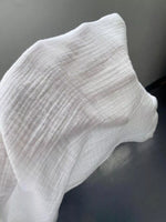 Close-up of a white sock on a dark background
