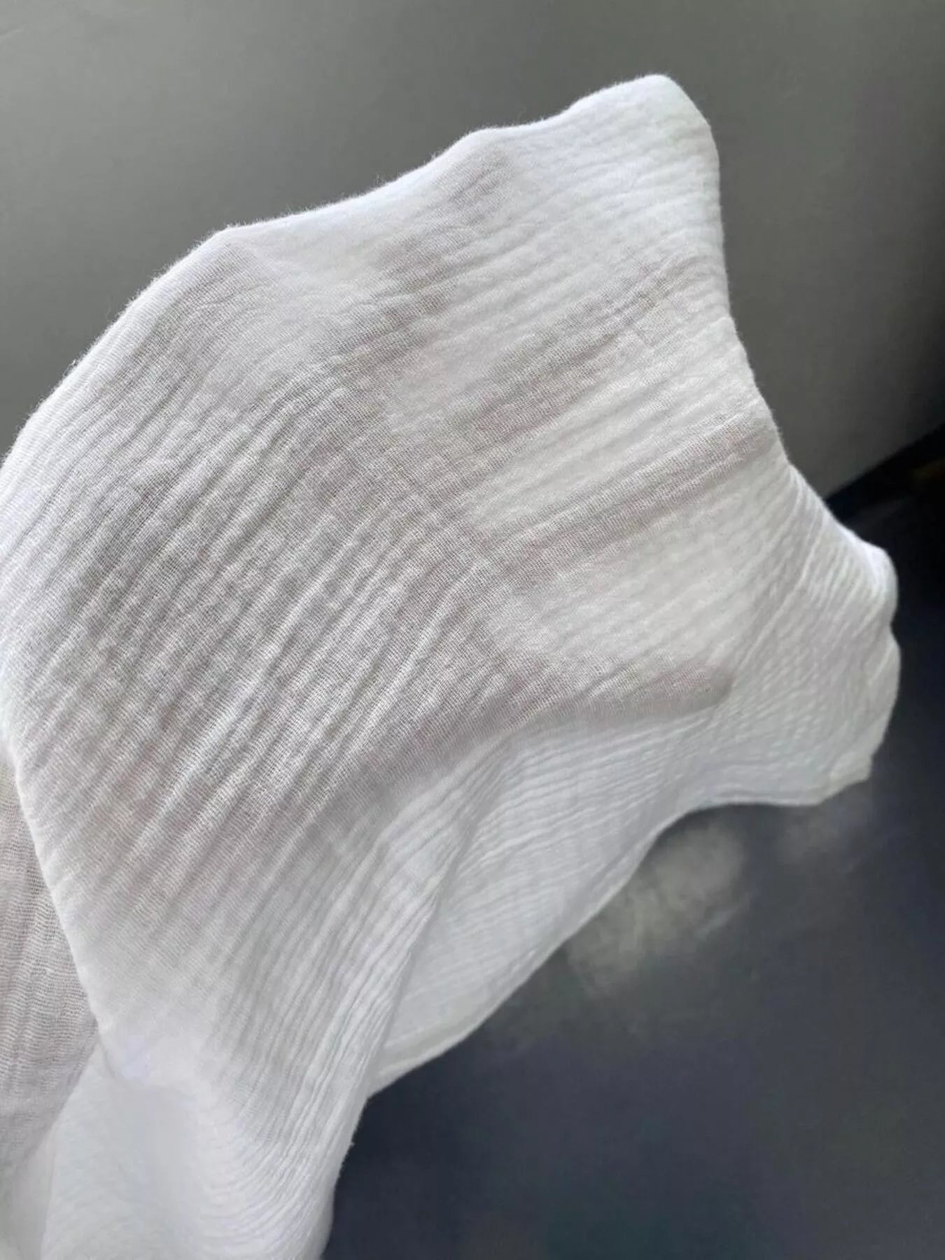 Close-up of a white sock on a dark background