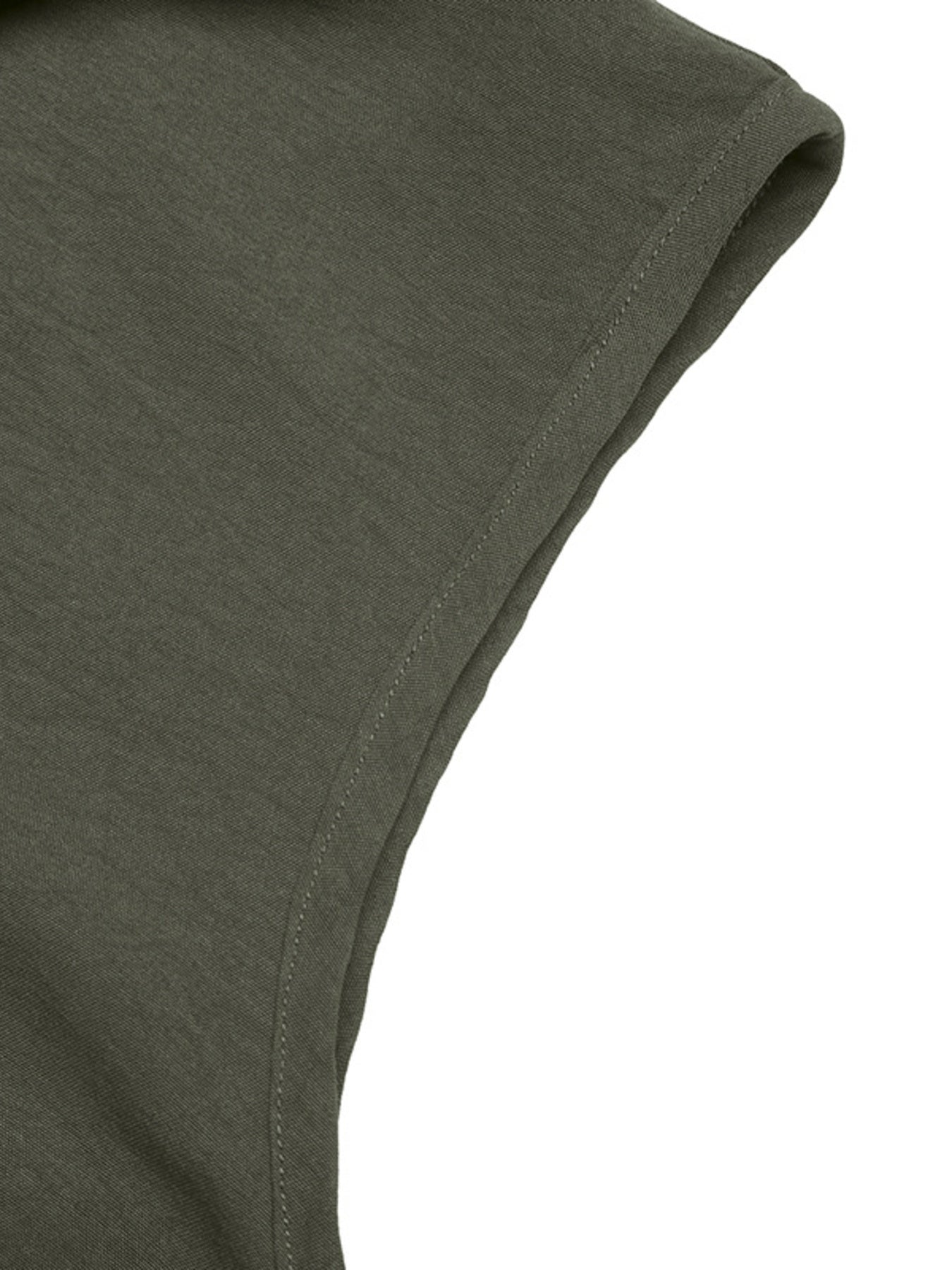 Close-up of a green fabric corner on a white background