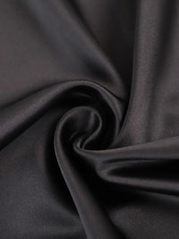 Close-up of dark gray fabric with folds