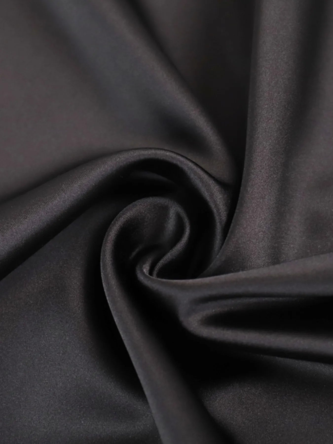Close-up of dark gray fabric with folds