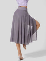 Person wearing a gray skirt with a sheer overlay on a white background