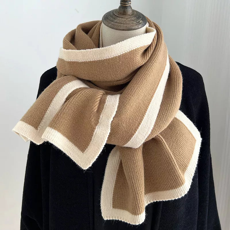 Knitted scarf with brown and beige stripes on a mannequin against a white background