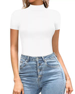 Person wearing a white turtleneck and blue jeans on a white background