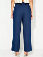 Person wearing navy blue pants on a white background