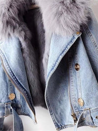 Denim jacket with fur hood on a white background