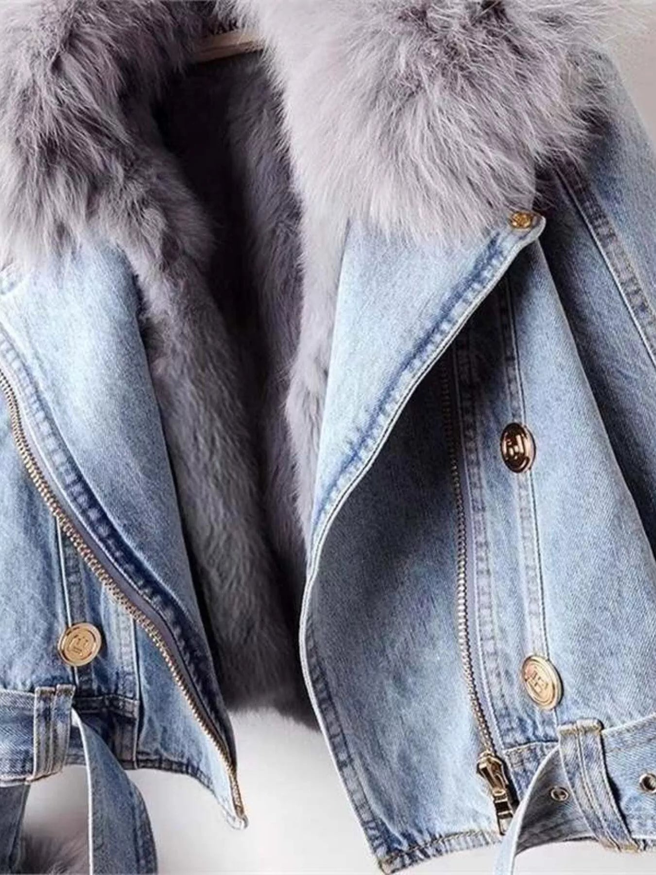 Denim jacket with fur hood on a white background