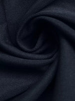 Close-up of dark blue fabric with a subtle pattern