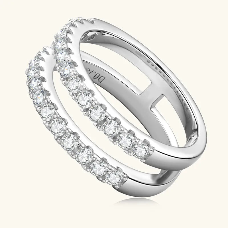 Silver ring with embedded diamonds on a white background