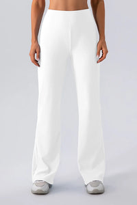 White wide-leg pants worn by a person on a plain background