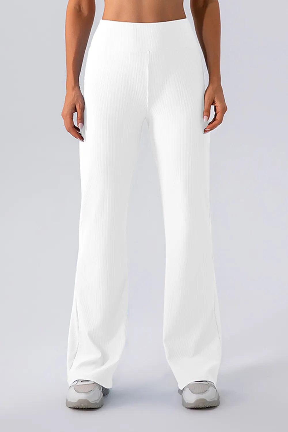 White wide-leg pants worn by a person on a plain background