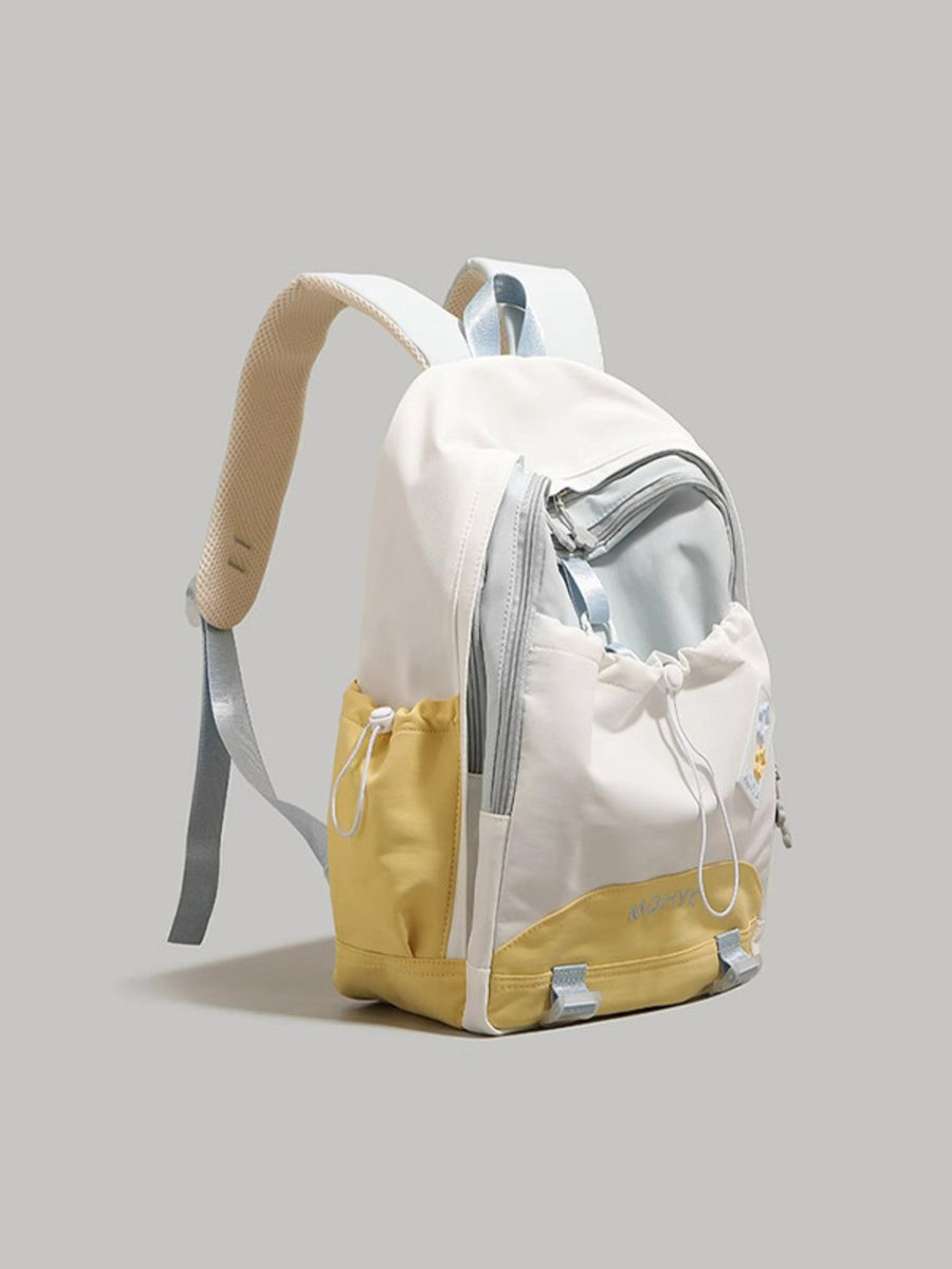 White and yellow backpack on a light gray background