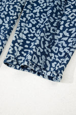 Blue leopard print fabric on a white background