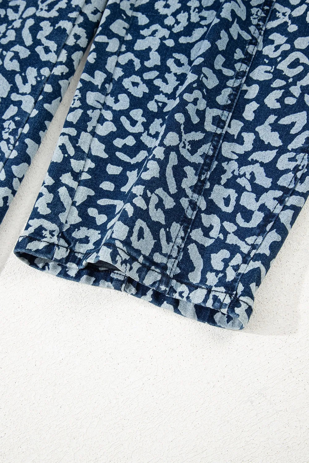 Blue leopard print fabric on a white background