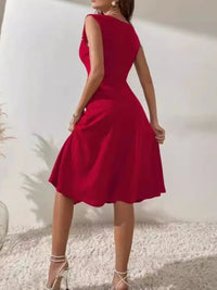 Red dress worn by a person against a white background