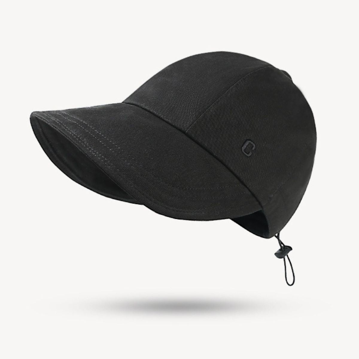 Black cap with a chin strap on a white background