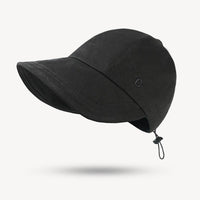 Black cap with a chin strap on a white background