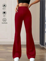 Red flared pants worn by a person with text icons indicating warmth, softness, and breathability on a neutral background.