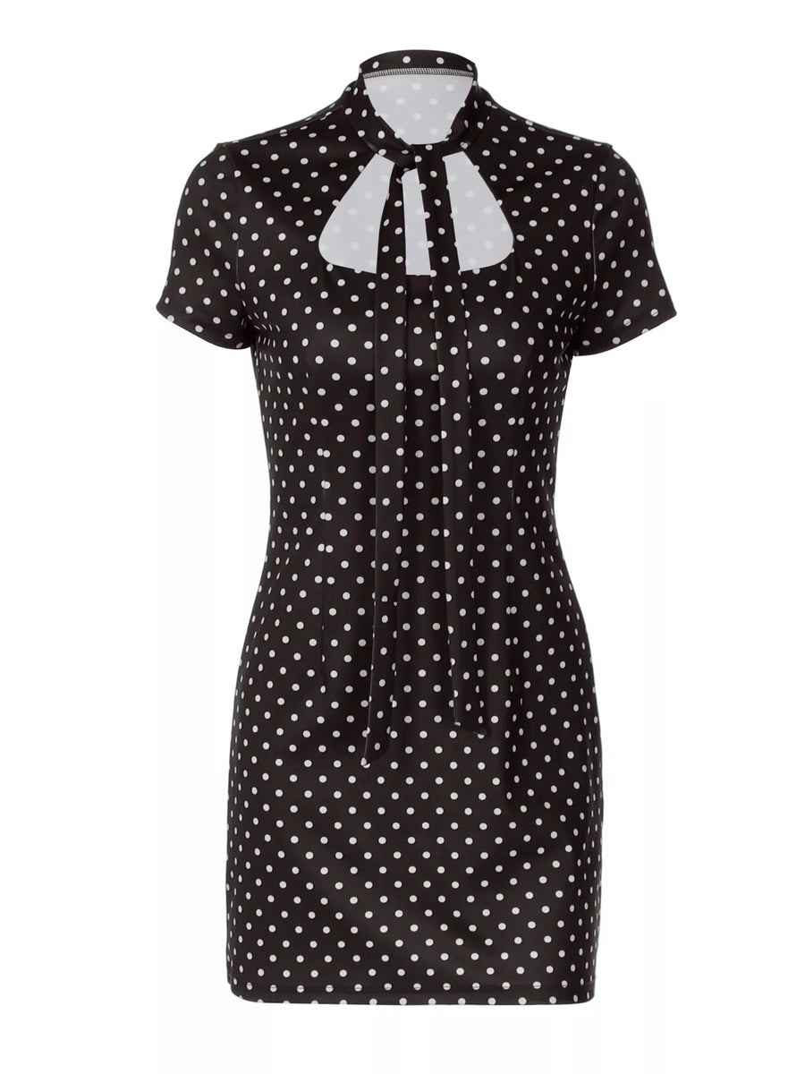 Black polka dot dress with a white collar on a white background