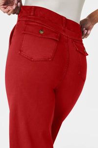 Red pants with a visible brand logo on a white background