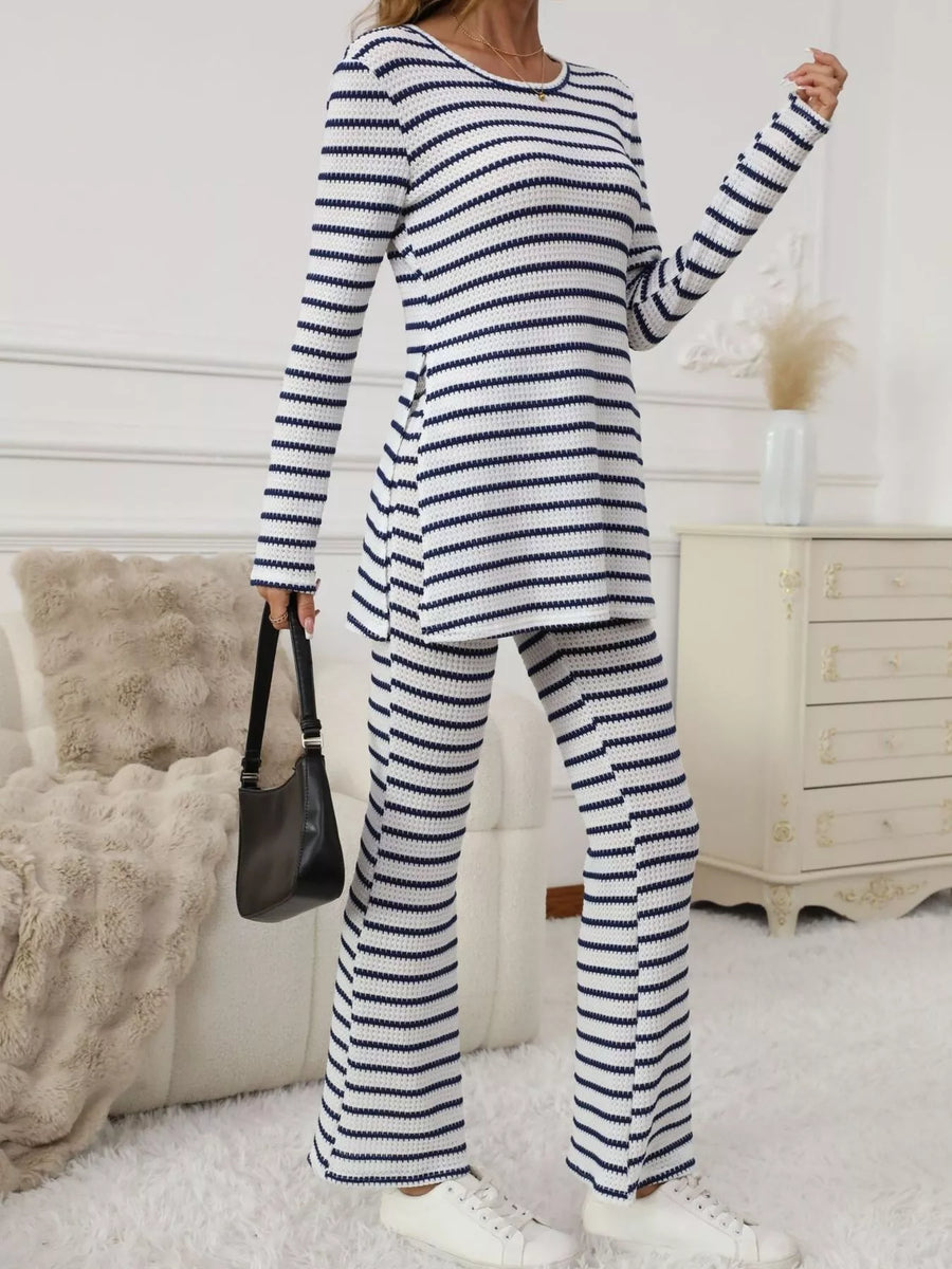 Person wearing a blue and white striped outfit in a room with a white dresser and beige sofa.