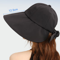 Black sun hat with wide brim and measurement on a light blue background
