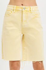 Yellow denim skirt on a white background