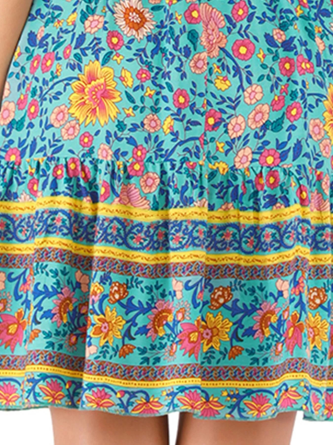Colorful floral and patterned dress with a close-up view.