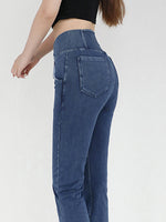 Blue jeans worn by a person on a white background