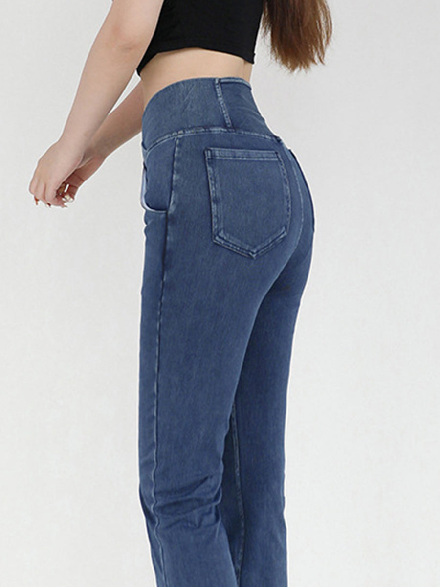 Blue jeans worn by a person on a white background