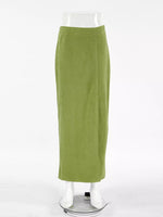 Green skirt on a mannequin against a white background
