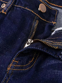 Close-up of a blue denim jacket with stitching details