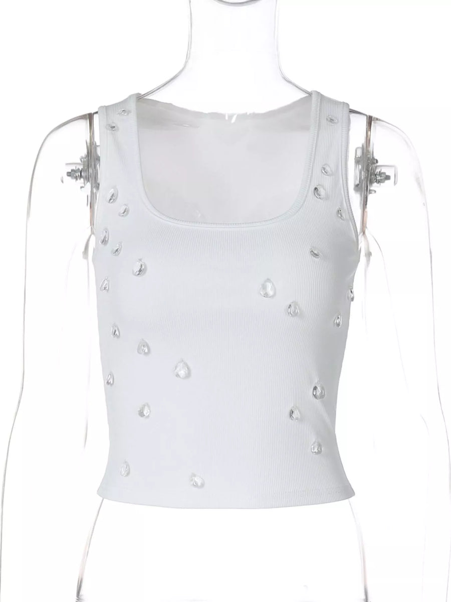 White tank top with pearl embellishments on a mannequin against a white background