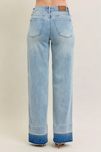 Light blue jeans with a beige background
