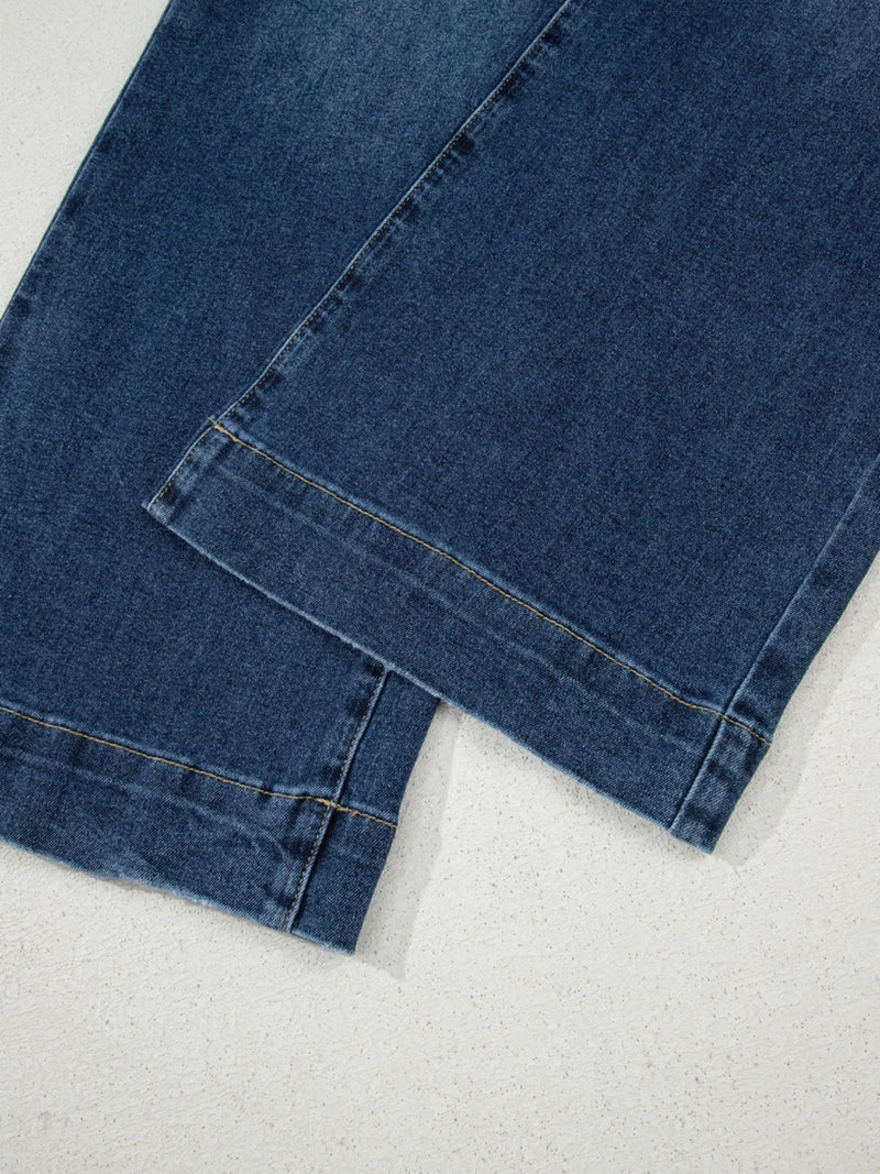 Close-up of blue denim fabric on a white background